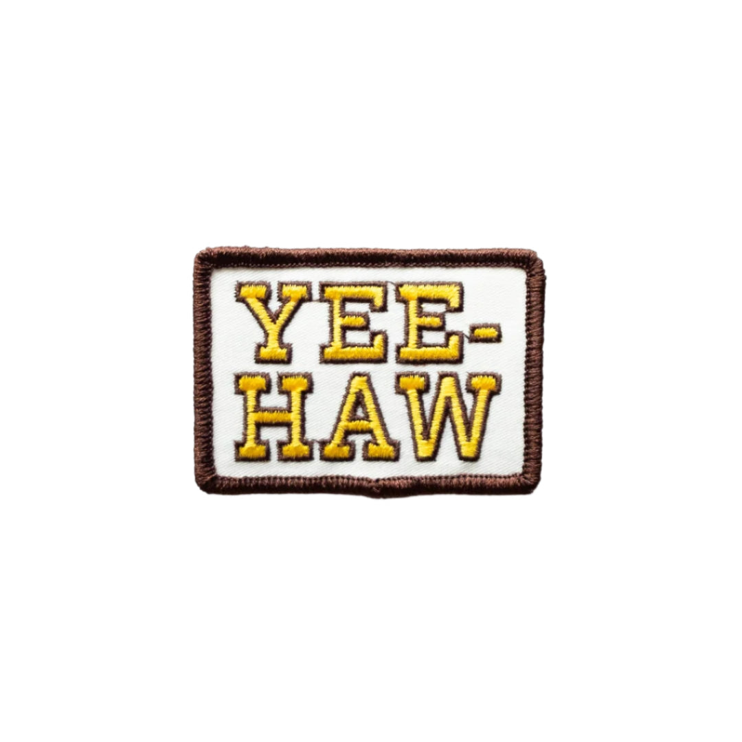 Embroidered patch with 'YEE-HAW' text on a white background