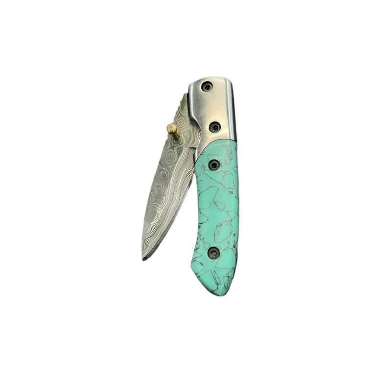 Folding knife with turquoise handle on a white surface.