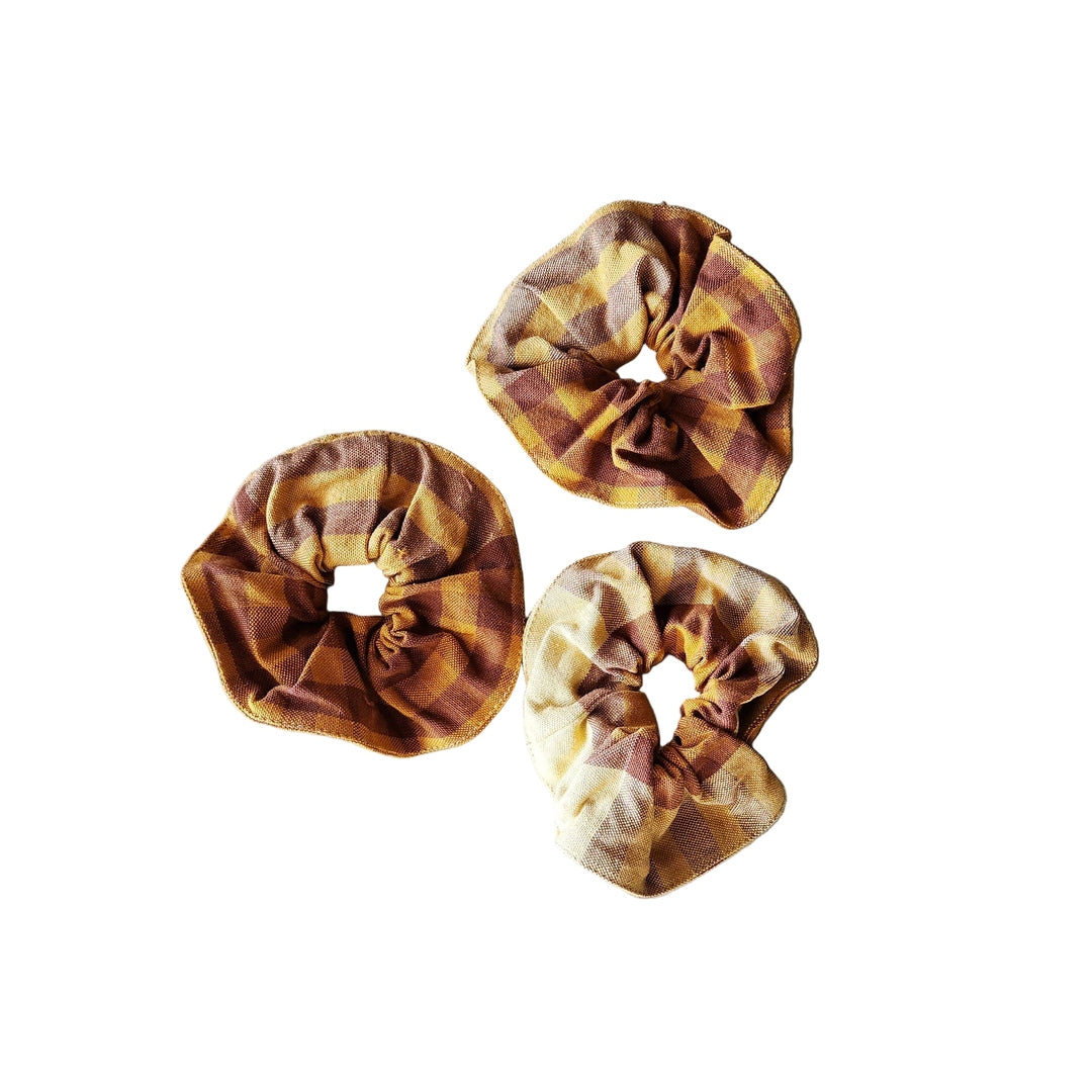 Three patterned scrunchies on a white background