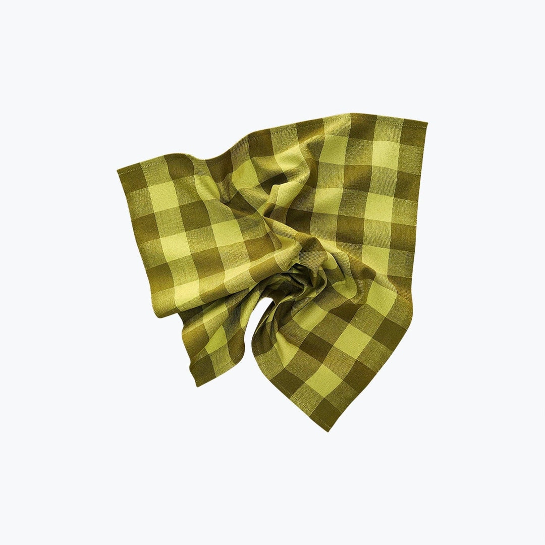 Green and yellow checkered fabric on a white background