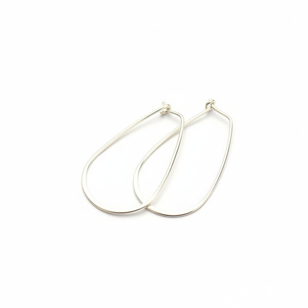 Silver hoop earrings on a white background
