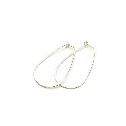 Silver hoop earrings on a white background