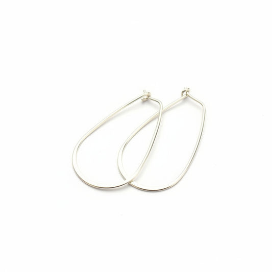 Silver hoop earrings on a white background