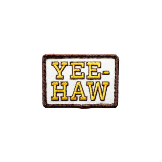 Embroidered patch with 'YEE-HAW' text on a white background