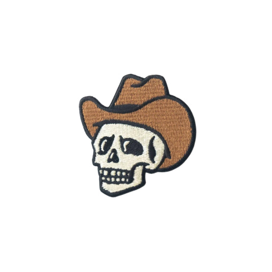 Patch of a skull wearing a cowboy hat on a white background